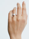 18CT WHITE GOLD EMERALD-CUT DIAMOND PICCADILLY RING