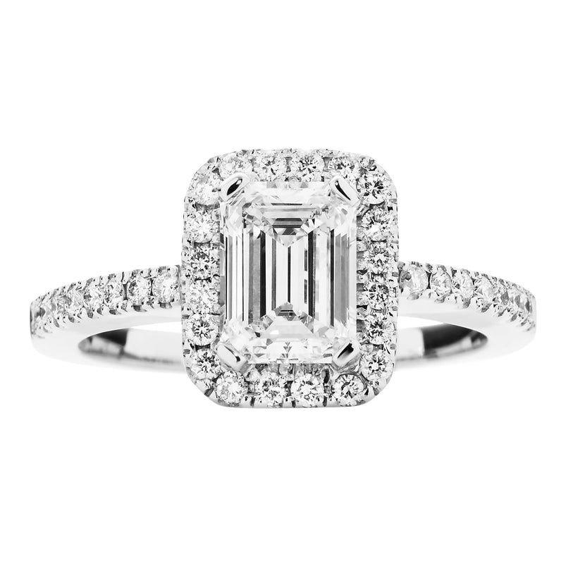 18CT EMERALD CUT DIAMOND PICCADILLY RING